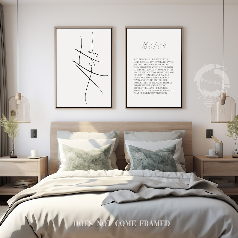 May include: Two black and white prints with a minimalist design. The left print features the word "Acts" in a stylized font. The right print features a Bible verse from Acts 16:31-34. The prints are displayed on a white wall above a bed with a white duvet and two green pillows.