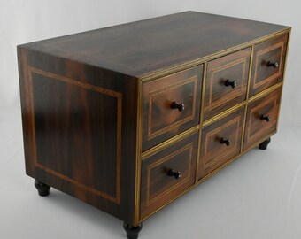 A Vintage Six-drawer Cabinet in Brazilian rosewood, Brazilian mahogany and with wood inlays