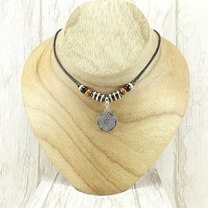 Celtic Engraved Medallion Choker Cord Necklace. Handmade Tribal Ethnic Celtic Style Choker with a Silver Tone Floral Engraving.