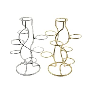 May include: Two decorative metal stands. One is silver-colored, the other is gold-colored. Each stand has a circular base, a central stem, and several circular holders extending outwards. The stands are designed to hold small items.
