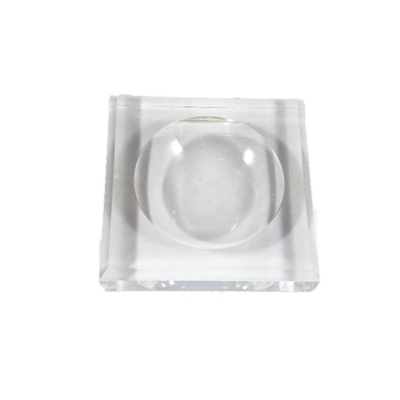 May include: A clear acrylic square dish with a round, raised, clear acrylic center.