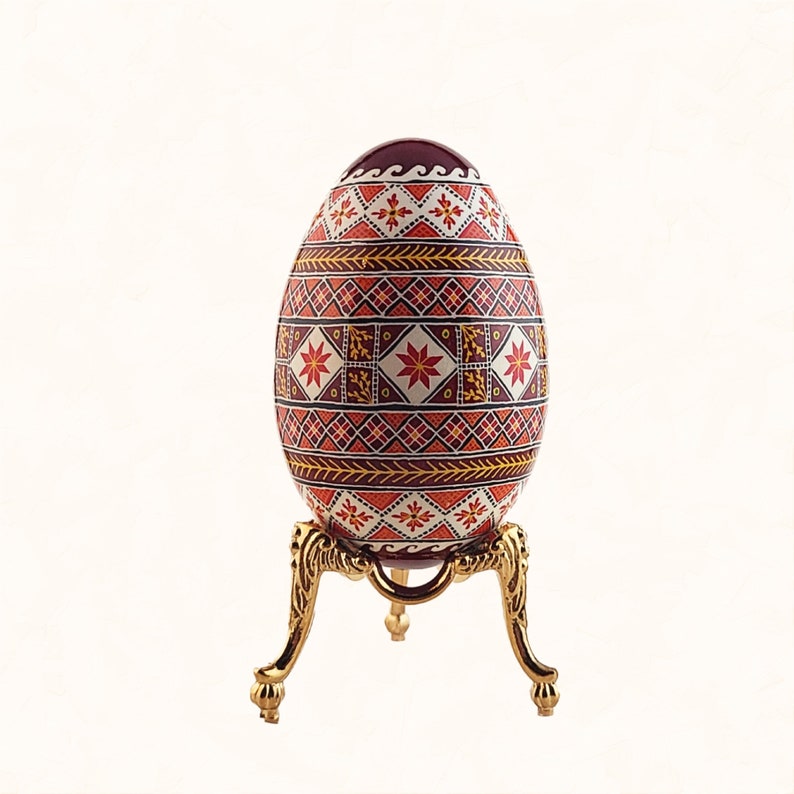 Ukrainian Easter egg, goose egg pysanky with dark red background, unique holiday gift decorative egg art, painted egg With tall gold stand