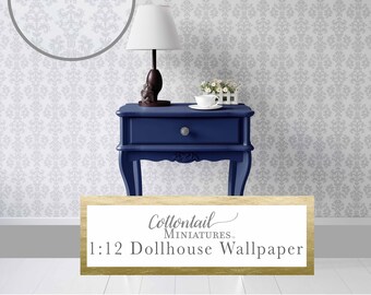 May include: A 1:12 scale dollhouse wallpaper with a damask pattern in gray and white. The wallpaper is shown on a blue nightstand with a lamp and a cup of tea.