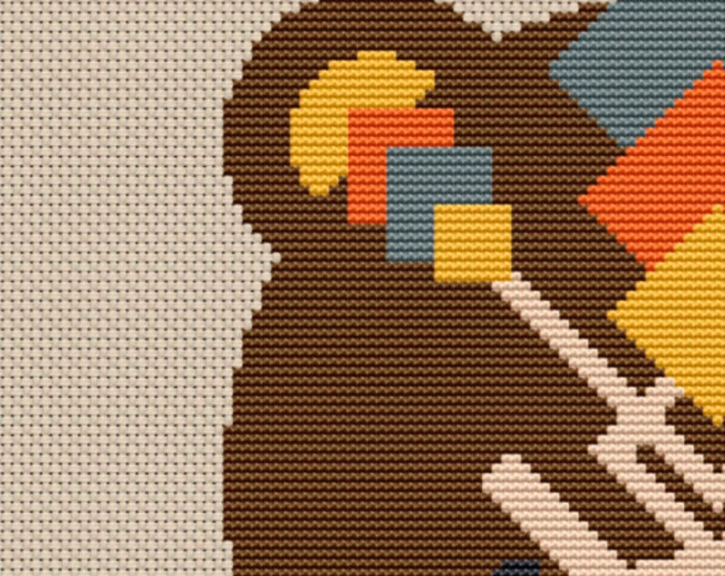 Peut inclure: Un gros plan sur un motif de point de croix g&eacute;om&eacute;trique brun, beige, jaune, orange et bleu. Le motif pr&eacute;sente une vari&eacute;t&eacute; de formes et de tailles, cr&eacute;ant un motif visuellement int&eacute;ressant et abstrait.