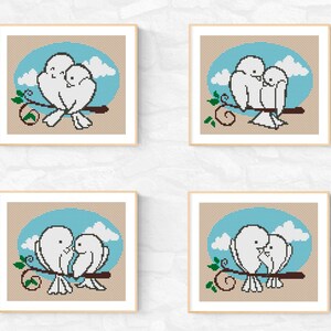 May include: Four cross-stitch patterns featuring two white birds perched on a branch with a blue sky and clouds in the background.