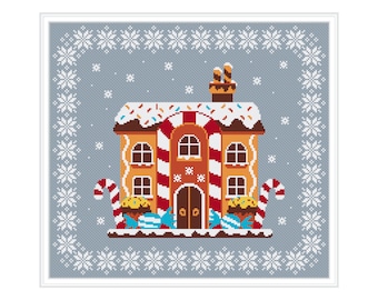 Può includere: Una casetta di pan di zenzero con accenti di bastoncino di zucchero e un tetto bianco glassato decorato con codette colorate. La casa è circondata da un bordo di fiocchi di neve bianchi su uno sfondo blu chiaro.