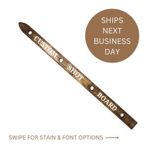 May include: A wooden shot board with the words "CUSTOM SHOT BOARD" written on it. The board has five holes for holding shot glasses.