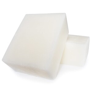 May include: Two white rectangular bars of soap.