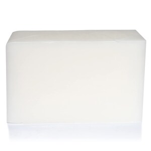 May include: A large, rectangular block of white, translucent soap.
