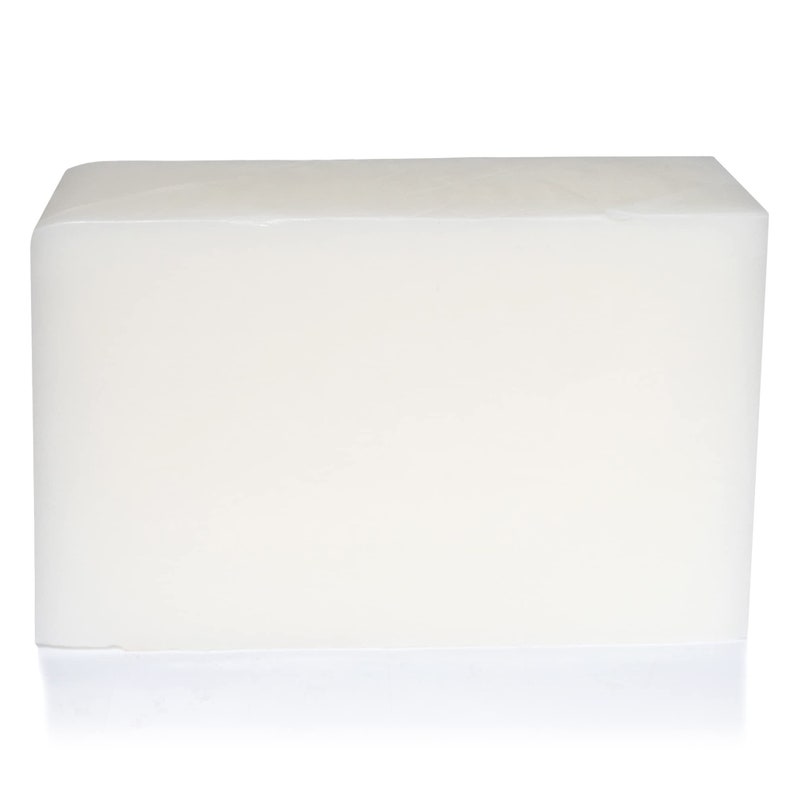 May include: A large, rectangular block of white, translucent soap.