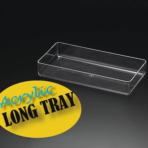 May include: A clear acrylic long tray. The tray is rectangular and has a smooth surface. The text "Acrylic Long Tray" is printed on a yellow circle.