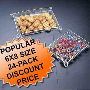 May include: Two clear plastic trays, one filled with small, round cookies and the other with colorful wrapped candies. An orange and white sign reads "POPULAR 6X8 SIZE 24-PACK DISCOUNT PRICE."