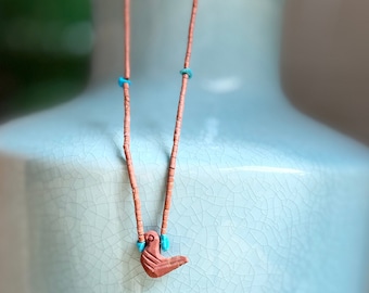 Serpentine necklace and its ceramic bird pendant