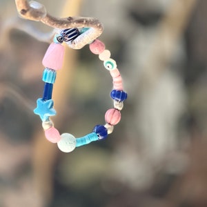 Gorgon bead bracelet, magnesite, chevron beads, ceramic star, pink heishi, agate, protective eye.