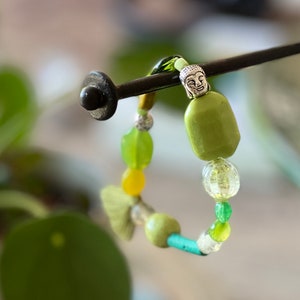 Bracelet in multi-colored African glass beads, agate, gorgon, Tibetan silver bead and green pompom. image 4