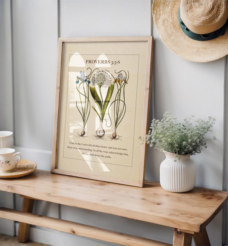 Printable featuring Proverbs 3:5-6 Bible Verse paired with illustrated vintage botanicals shown on a wood bench with vase and tea set.