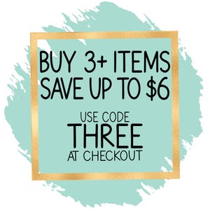 a promotional message for a sale, with the text "BUY 3+ ITEMS SAVE UP TO $6 USE CODE THREE AT CHECKOUT" displayed in a gold frame.
