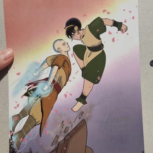 May include: Illustration of two characters from Avatar: The Last Airbender. One character is in a brown and orange outfit with blue energy, the other in green and tan, kicking. Pink flower petals float in the air against a pink and purple background.