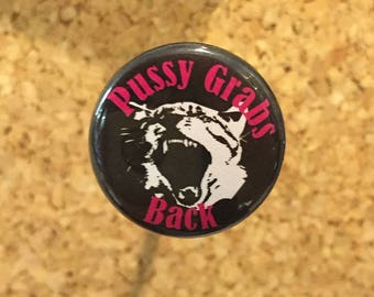 Pussy Grabs Back 1" pin/magnet