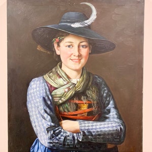 May include: A painting of a woman wearing a blue and white checkered dress and a black hat with a white feather. She is smiling and has her arms crossed. The background is a dark brown.