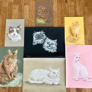 May include: A collection of nine vintage cat illustrations printed on paper. The illustrations feature cats of different breeds and colours in various poses. Some of the cats are sitting, while others are lying down or standing. The illustrations are all in a realistic style and are framed in white.