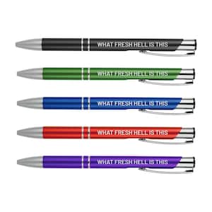 May include: Five pens with silver accents and a white inscription that reads "WHAT FRESH HELL IS THIS". The pens are black, green, blue, red, and purple.
