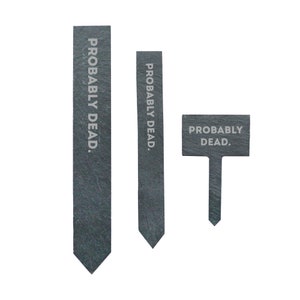 May include: Three black slate plant markers with the text "PROBABLY DEAD."  The markers are in different shapes and sizes.