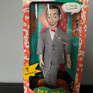Muñeco parlante de Pee Wee Herman de la casita de juegos de Pew Wee, caja de cerillas sin abrir.