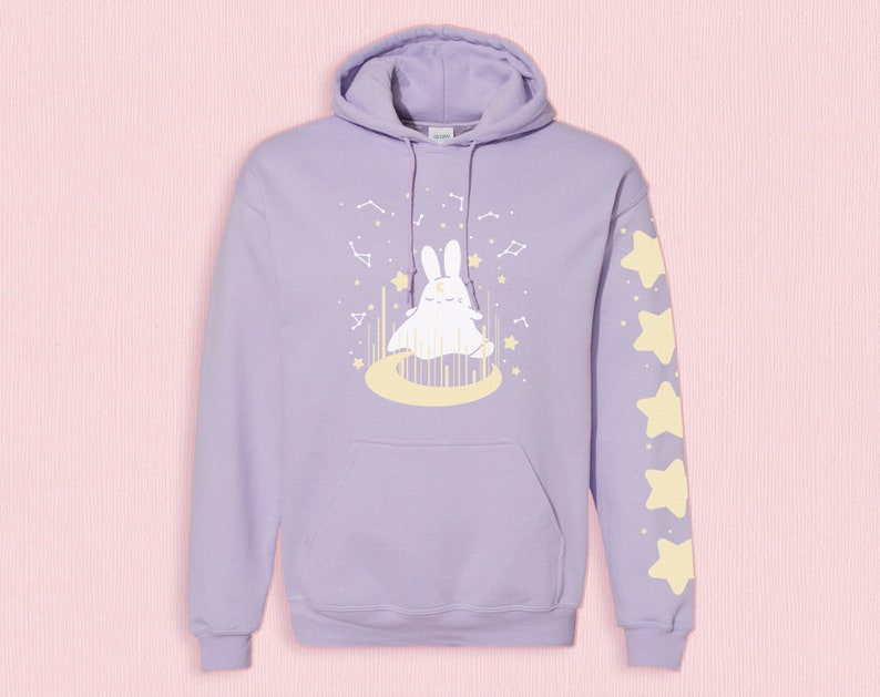 Kawaii pastel goth purple hoodie with a ghost bunny on it surrounded by stars, sparkles, and constellations. Artwork by nikusagi.