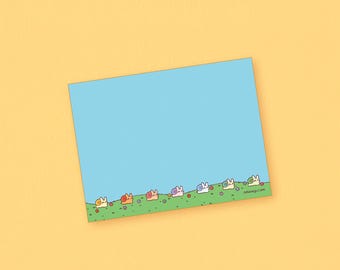 May include: A light blue notecard with a line of colorful snails on a green grassy field at the bottom. The snails are all different colors and have different expressions on their faces. The text "nuunaju.com" is at the bottom right corner of the card.