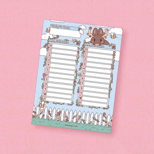 May include: A decorative daily schedule notepad with a light blue background, featuring a cartoon moose and floral accents. The notepad includes sections for the date and hourly schedules, with a white picket fence design at the bottom. The website address is visible at the bottom.