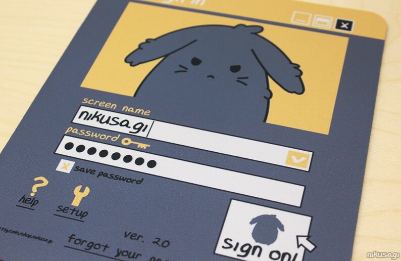 May include: A grey mousepad with a cartoon login screen design. The screen shows fields for a screen name and password, with "nikusagi" pre-filled. A cartoon bunny is at the top. The words "Sign on" are also visible.