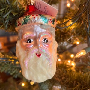 Vintage Christopher Radko Santa face, holly trimmed cap.  Still has tag.  4” high.