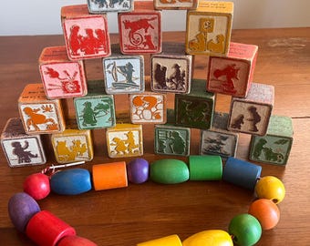 20 vintage nursery rhyme wooden blocks and string of 16 wooden beads.