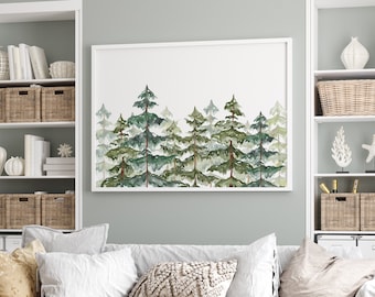 May include: A white sofa with pillows and a woven coffee table in a living room with white built-in shelves, a framed watercolor painting of a forest, and a woven rug on the floor.
