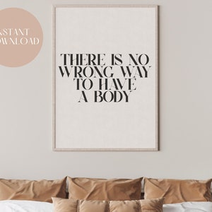 Puede incluir: Una impresi&oacute;n enmarcada con el texto "No hay una forma incorrecta de tener un cuerpo" en texto negro sobre fondo blanco.