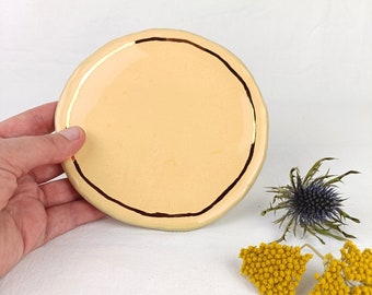 Ceramic saucer pastel with gold rim