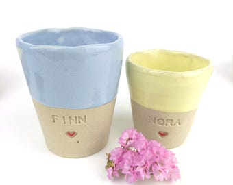 Personalized ceramic children's mugs in various colors with a heart