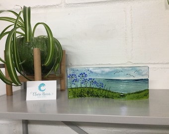 Fused glass, Cornish sea scene with agapanthus. Freestanding wave, 9cm tall. Handmade in Cornwall. Free uk postage