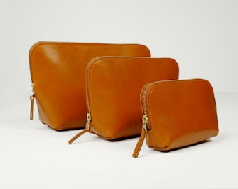 Cosmetic Bags, three sizes with zipper, real leather, color cognac