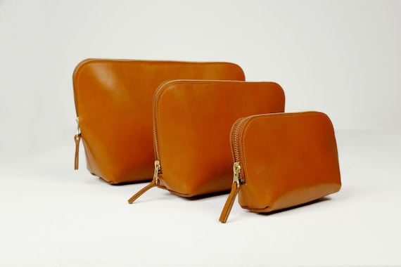 Cosmetic Bags, three sizes with zipper, real leather, color cognac