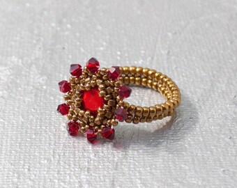 Ring with antique Swarovski crystal in red and gold Japanese glass beads