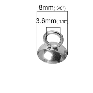 May include: Silver-toned metal loop with a round base, measuring 3/8 inch in diameter and 1/8 inch in height. This loop is ideal for hanging jewelry or other small items.