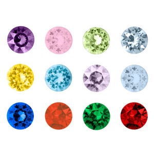 Könnte beinhalten: Zwölf runde, facettierte Edelsteine in verschiedenen Farben, darunter lila, rosa, gelb, blau, grün und rot. Die Edelsteine sind in drei Reihen zu vier angeordnet.