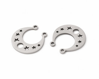May include: Two silver crescent moon charms with cut-out stars. The charms have two holes for attaching to jewelry.