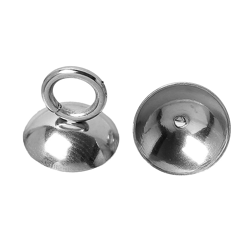 May include: Silver-toned metal bead caps with a loop on top. The caps are designed to cover the end of a string or cord.