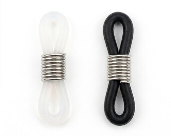 May include: Two eyeglass retainers, one white and one black, are displayed against a white background. Each retainer features a loop for the glasses arm and a metal coil. The white retainer is translucent, while the black one is solid.