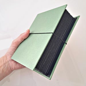Polaroid Organette Album, 48 uitvouwbare pagina's, zwart of wit karton, met foto-uitsparingen, formaat 10x14x6cm, diverse omslagkleuren