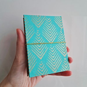 Mini Album ad organetto per Instax Mini, 18 pagine frontali, carta cotone oro turchese, variante con tagli per foto, fatto a mano in Italia