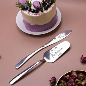 May include: A silver cake knife and server set with the text "Mr. & Mrs. Rodriguez 11.22.2020" engraved on the server. The knife has the text "Mr. & Mrs. Rodriguez" engraved on the blade.